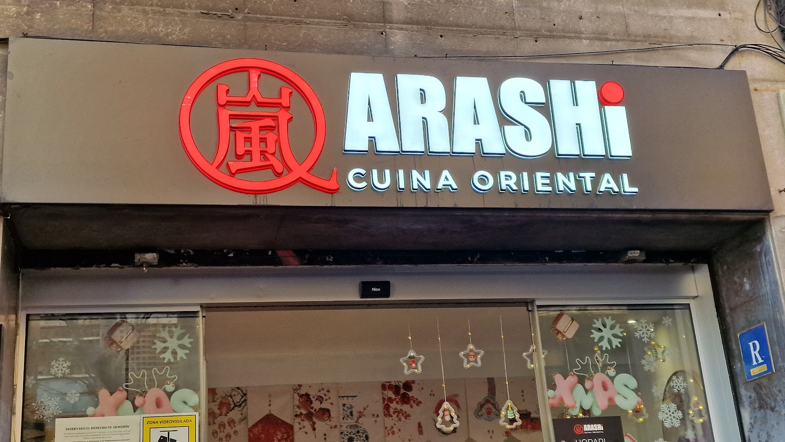 Storefront of Arashi Cuina Oriental restaurant with brown signage